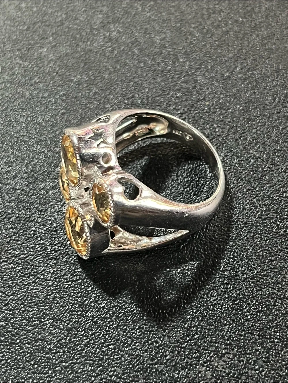 Sterling silver ring w/ 4 citrine gemstones. Sz 7. Pretty, unique design. 925